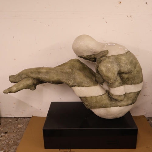 3038 - A contemporary sculpture of a nude man in composite resin with a rectangular pedestal base. Width 93... 