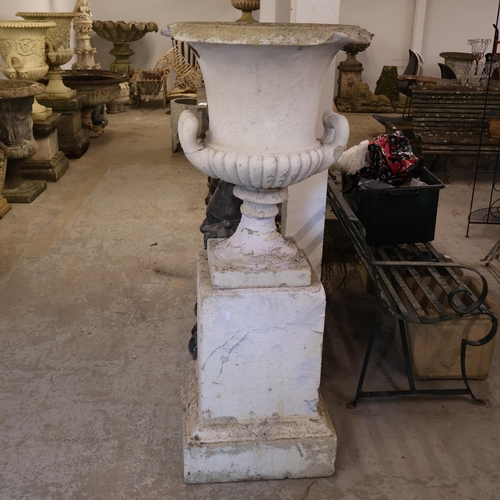 3042 - A large painted three section stone medici urn with weathered finish on square pedestal base. Diamet... 