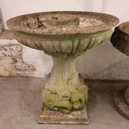 3045 - A large and impressive reconstituted stone and concrete three section planter with moulded decoratio... 