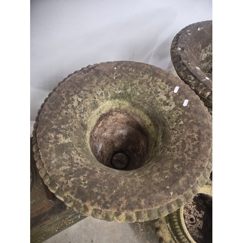 3026 - A pair of large and impressive two section campana style urns in reconstituted stone with foliate de... 