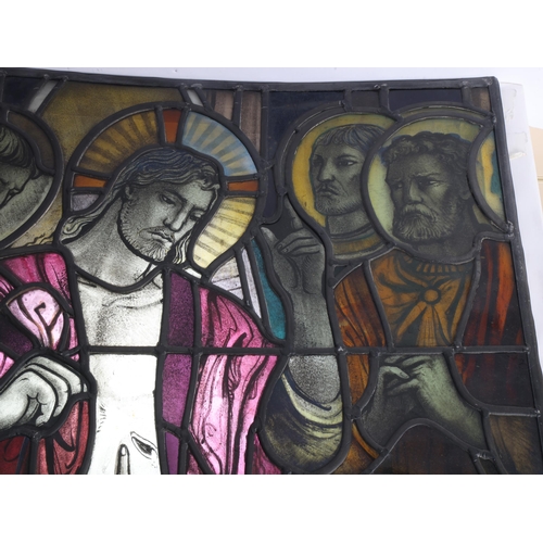 251 - A late 19th early 20th century stained glass religious window panel in the manner of Douglas Stracha... 