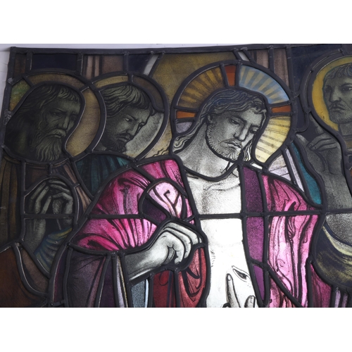 251 - A late 19th early 20th century stained glass religious window panel in the manner of Douglas Stracha... 
