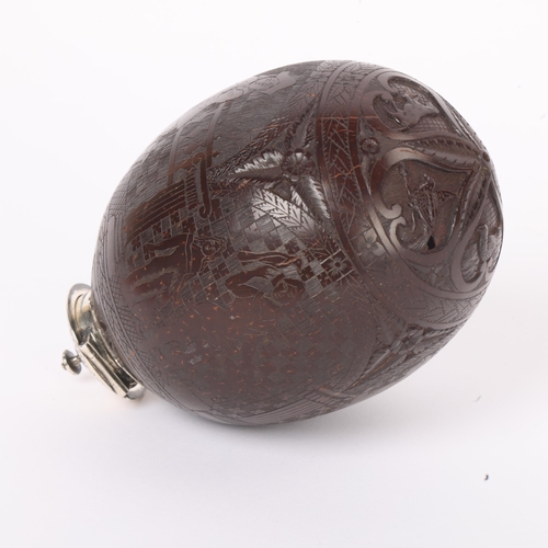 254 - A 19th century coconut shell bugbear flask, finely carved and engraved with Renaissance style Archad... 