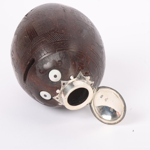 254 - A 19th century coconut shell bugbear flask, finely carved and engraved with Renaissance style Archad... 