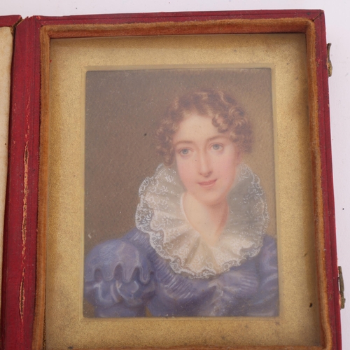 262 - A 19th century miniature portrait of a woman wearing a blue dress with lace ruff, watercolour on ivo... 