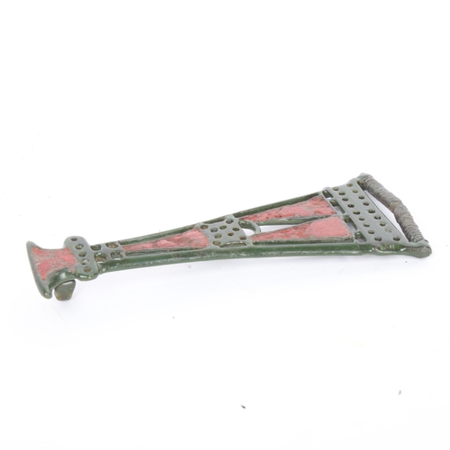 266 - An Iron Age bronze Celtic openwork brooch, with red enamel panels, length 13.5cm