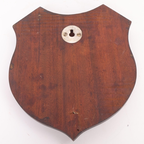 279 - HORSE RACING INTEREST - a Vintage iron horseshoe mounted on wooden shield inscribed 