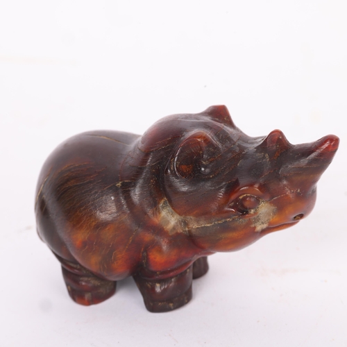 283 - A Chinese rhino horn rhino design netsuke, late 19th/early 20th century, length 7cm.  Please note th... 