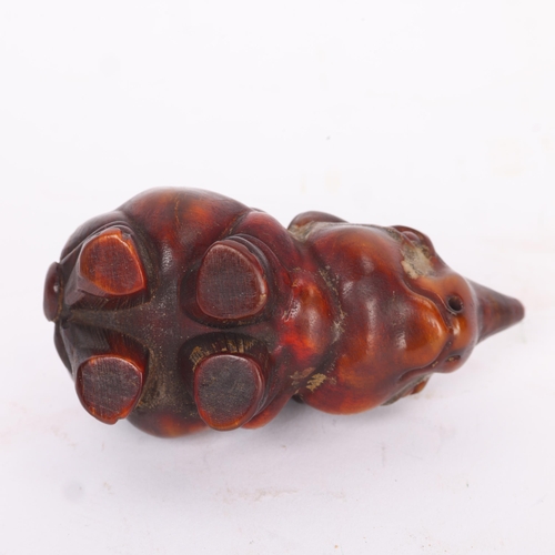 283 - A Chinese rhino horn rhino design netsuke, late 19th/early 20th century, length 7cm.  Please note th... 