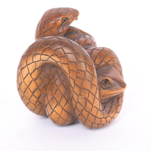 286 - A Japanese carved wood cobra and frog design netsuke, early to mid-20th century, signed, height 4cm