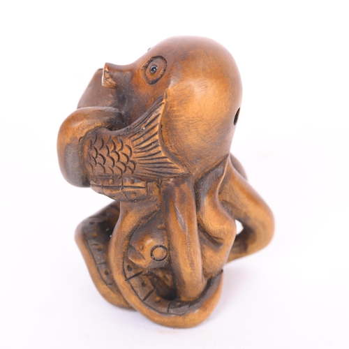 287 - A Japanese carved wood octopus and fish design netsuke, early to mid-20th century, signed, height 4.... 