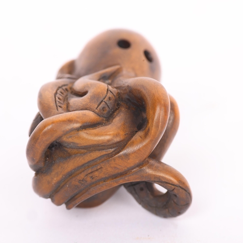 287 - A Japanese carved wood octopus and fish design netsuke, early to mid-20th century, signed, height 4.... 