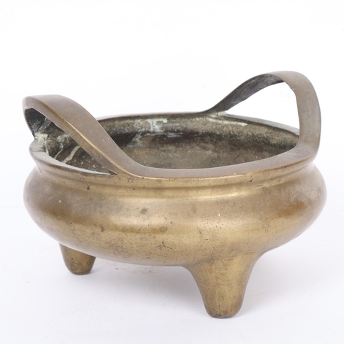 293 - A Chinese bronze 2-handled incense burner, relief cast dragon seal mark under base, diameter 22cm