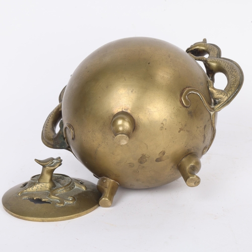294 - A Chinese bronze incense burner, with dragon handles, height 19cm