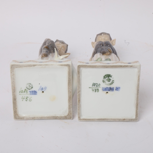 298 - A pair of Royal Copenhagen figures of fauns sitting on a column, height 21cm