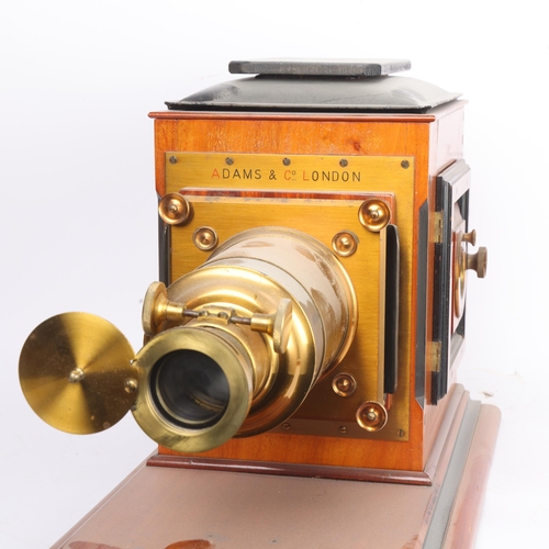 304 - THE DR RICHARD BAINES MAGIC LANTERN COLLECTION - an Adams & Co 19th century mahogany and brass cased... 