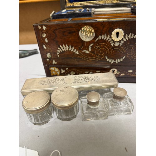 273 - A 19th century rosewood toilet/sewing box, with inlaid brass mother-of-pearl and amboyna marquetry d... 