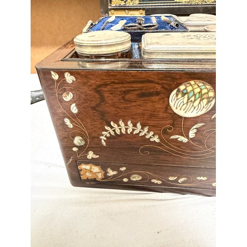 273 - A 19th century rosewood toilet/sewing box, with inlaid brass mother-of-pearl and amboyna marquetry d... 