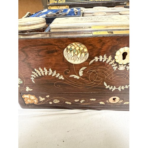 273 - A 19th century rosewood toilet/sewing box, with inlaid brass mother-of-pearl and amboyna marquetry d... 