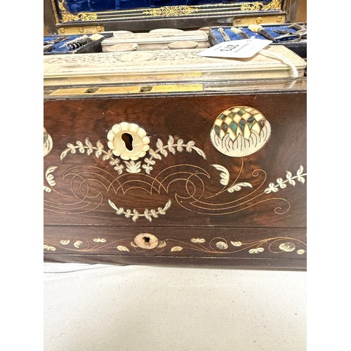273 - A 19th century rosewood toilet/sewing box, with inlaid brass mother-of-pearl and amboyna marquetry d... 