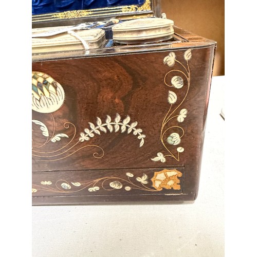 273 - A 19th century rosewood toilet/sewing box, with inlaid brass mother-of-pearl and amboyna marquetry d... 