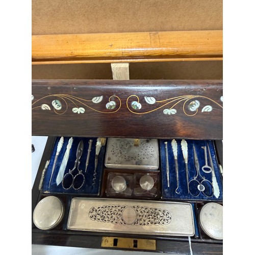 273 - A 19th century rosewood toilet/sewing box, with inlaid brass mother-of-pearl and amboyna marquetry d... 