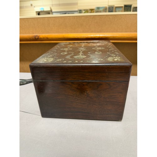 273 - A 19th century rosewood toilet/sewing box, with inlaid brass mother-of-pearl and amboyna marquetry d... 