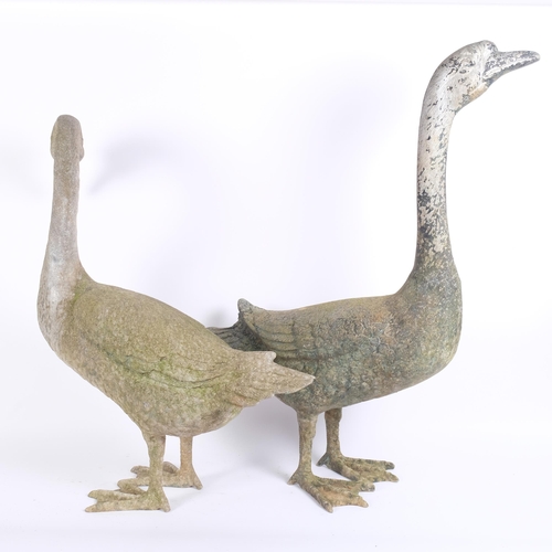 13 - A life-size pair of weathered spelter model geese, H70cm