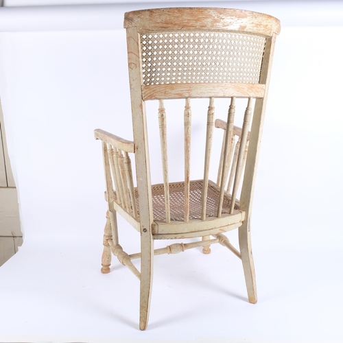 47 - A Swedish child's armchair, 19thC, with original painted finish and cane panels, H77cm (top rail dam... 