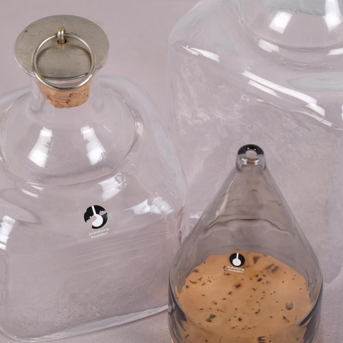 24 - Pukeberg, Sweden, two glass bottles one with stopper and label, together with a GORAN WARFF for Puke... 