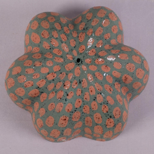 32 - KATE MALONE (b.1959-), British, a studio ceramic flower head or seed pod, double walled with varied ... 