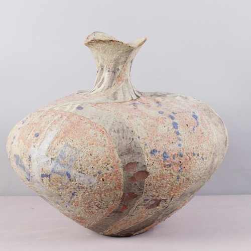 51 - JULIAN KING-SALTER (born 1954), a large twisted bottle form studio pottery vessel, with textured sur... 