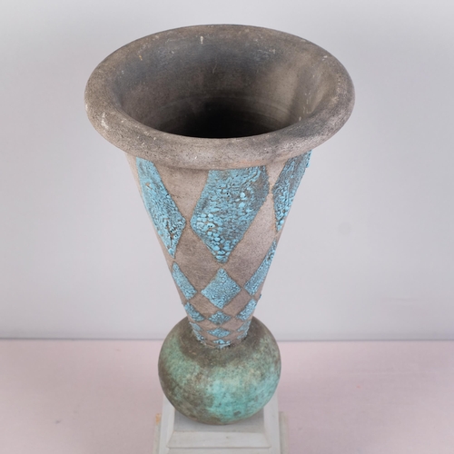 52 - A raku fired Urn form vessel with blue glaze, balanced on purpose built wooden plinth, unsigned, ove... 