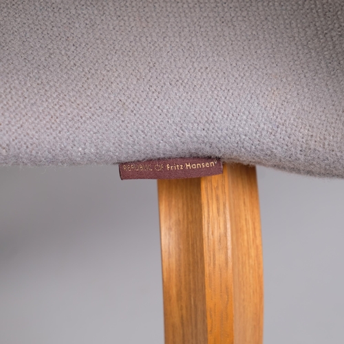 55 - A set of 4 ARNE JACOBSEN Grand Prix chairs by Fritz Hansen, the fully upholstered seat on shaped lam... 