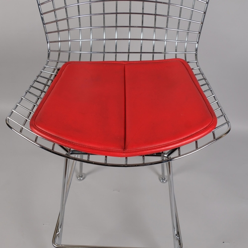 56 - HARRY BERTOIA, a Knoll Studio bar stool, the polished steel wire frame with leather seat pad, impres... 