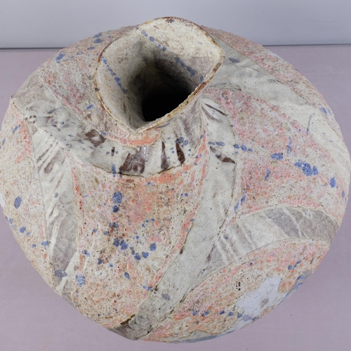 51 - JULIAN KING-SALTER (born 1954), a large twisted bottle form studio pottery vessel, with textured sur... 