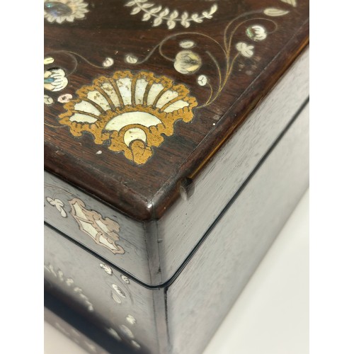 273 - A 19th century rosewood toilet/sewing box, with inlaid brass mother-of-pearl and amboyna marquetry d... 