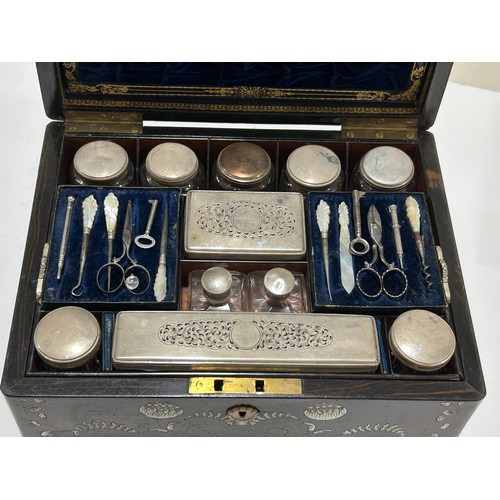 273 - A 19th century rosewood toilet/sewing box, with inlaid brass mother-of-pearl and amboyna marquetry d... 