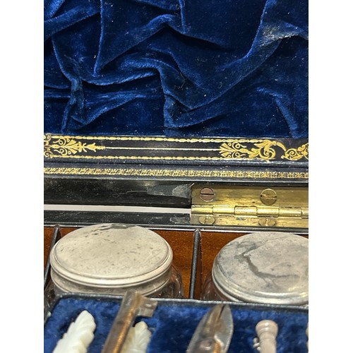 273 - A 19th century rosewood toilet/sewing box, with inlaid brass mother-of-pearl and amboyna marquetry d... 