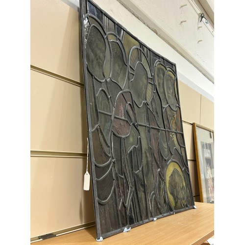 251 - A late 19th early 20th century stained glass religious window panel in the manner of Douglas Stracha... 