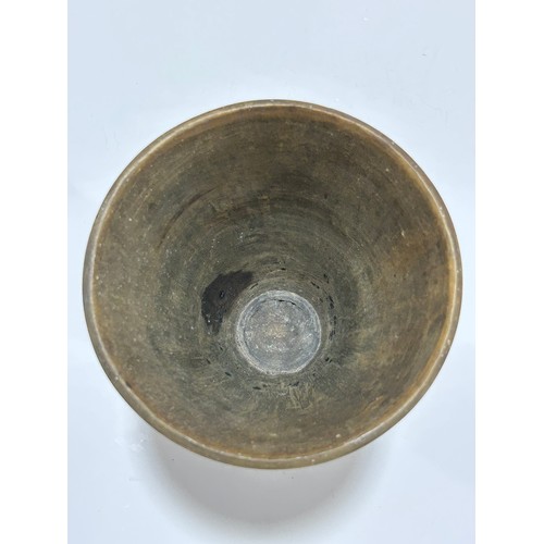 277 - A large Antique Continental rhino horn ceremonial cup, probably late 19th century, on unmarked white... 