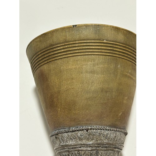 277 - A large Antique Continental rhino horn ceremonial cup, probably late 19th century, on unmarked white... 