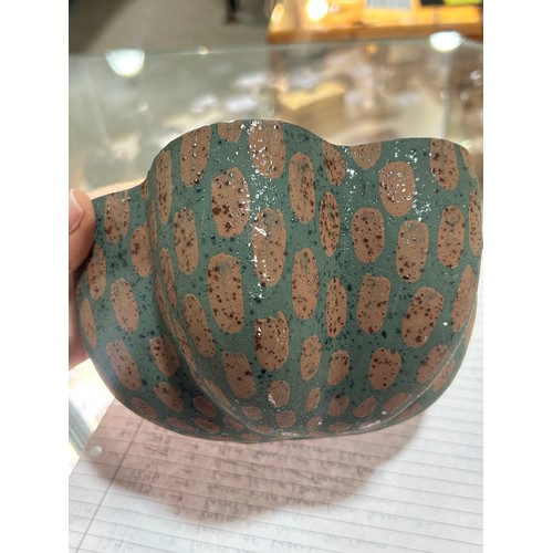 32 - KATE MALONE (b.1959-), British, a studio ceramic flower head or seed pod, double walled with varied ... 