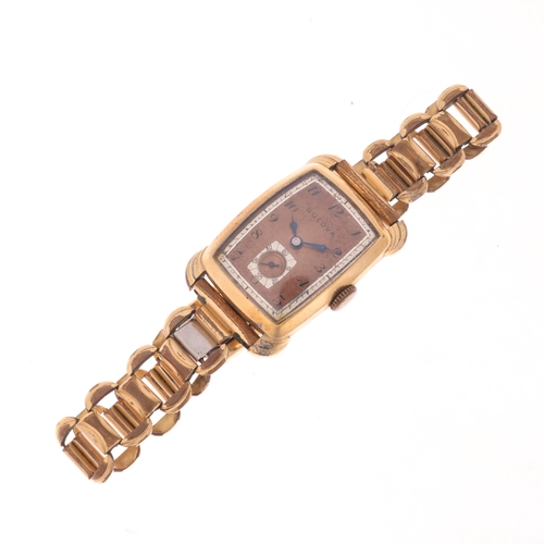 1058 - BULOVA - a Vintage gold plated stainless steel mechanical bracelet watch, circa 1940s, coppered dial... 