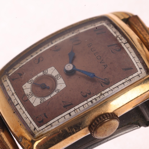 1058 - BULOVA - a Vintage gold plated stainless steel mechanical bracelet watch, circa 1940s, coppered dial... 
