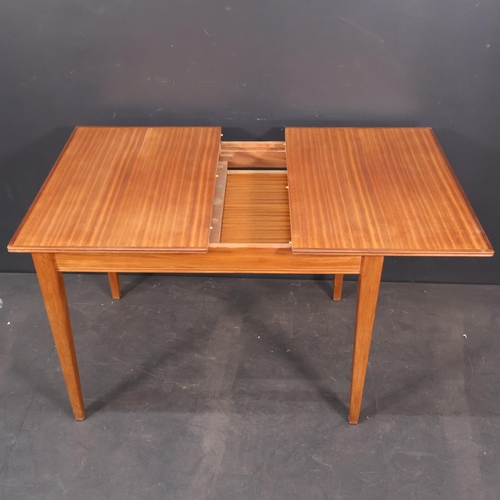 2025 - A Vintage Teak and Afromosia veneered extending Dining Table by Russell of Broadway. W108cm, H76cm, ... 