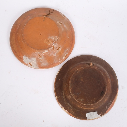 17 - A Ukraine Kosiv terracotta plate with horse design, diameter 25cm, and a Continental slip glazed ter... 