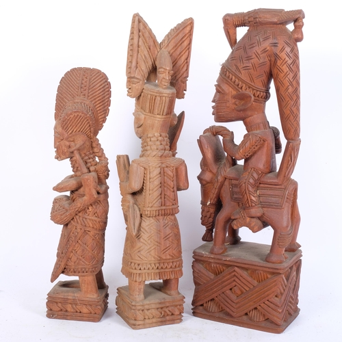 49 - A group of 3 Yoruba (Nigeria) carved wood figures, largest H46cm (3)