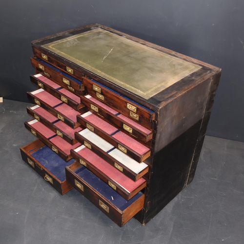 2001A - An early 20th century 24 drawer mahogany collector's chest, with tooled and embossed green leather s... 
