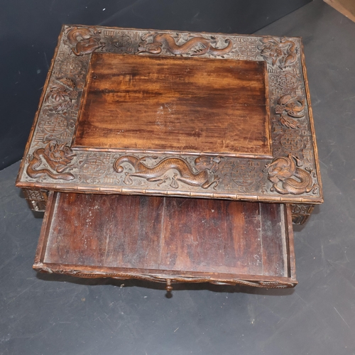 2001B - A 19th century Chinese hardwood folding travelling scribe's desk, with profuse dragon and character ... 